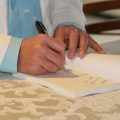 signing-a-book-r